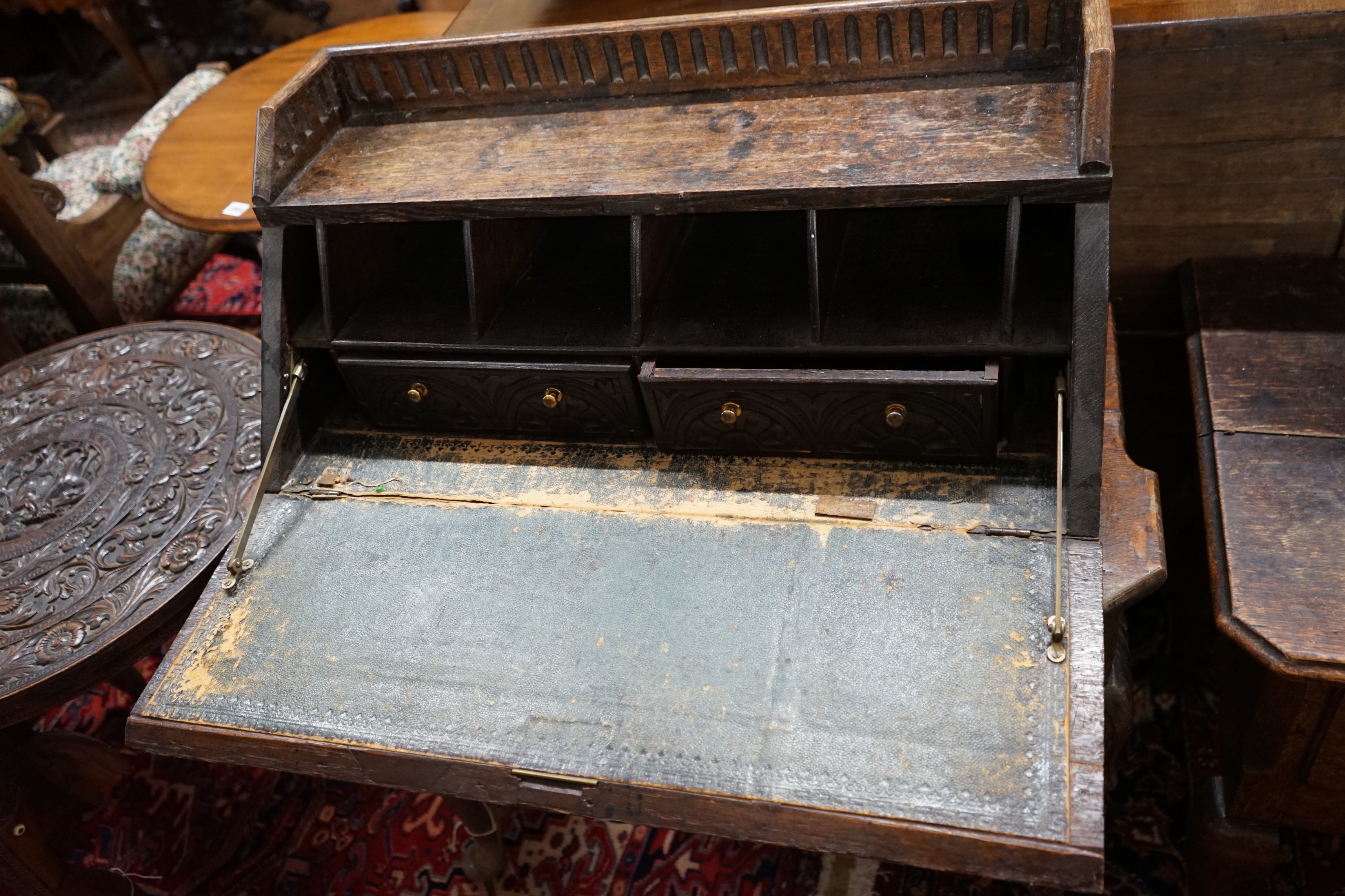 An 18th century style carved oak bureau, width 79cm, depth 36cm, height 99cm